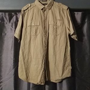 A tan short sleeve button up shirt